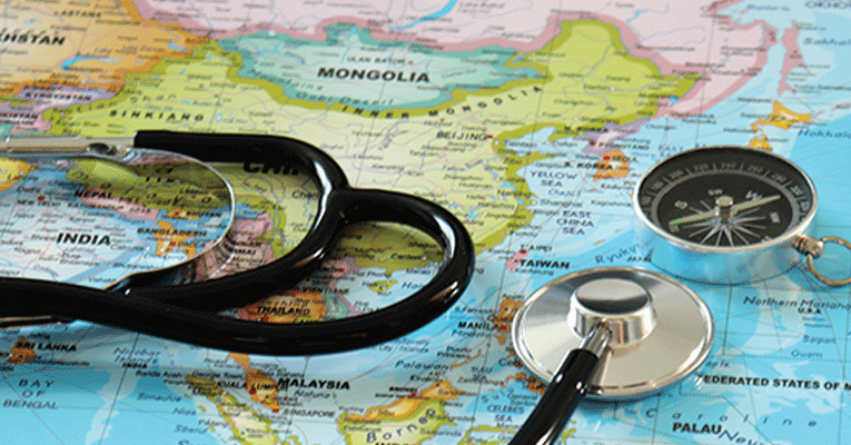 stethoscope on top of global map