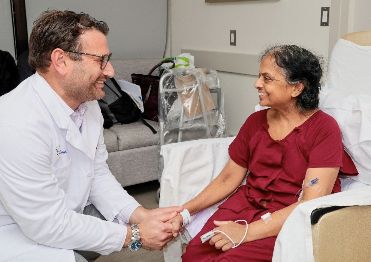 Cancer patient diane moore hugs her physician Lisa Dos Santos, MD